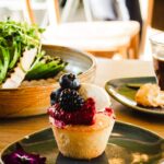 cupcake with berry toppings on plate