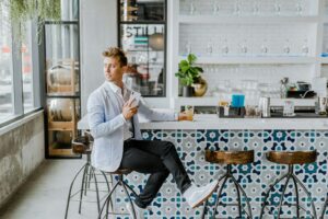 man sitting at dealership lounge